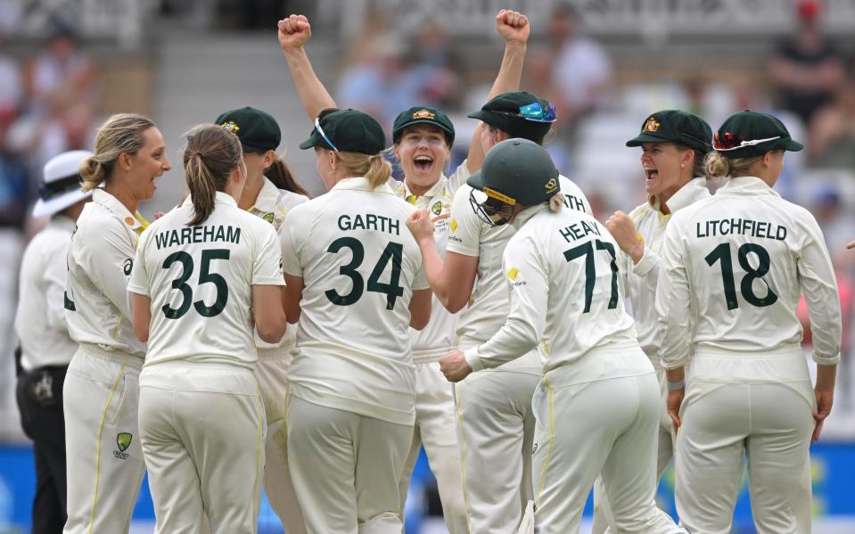 Australia celebrate after England captain Heather Knight is given out