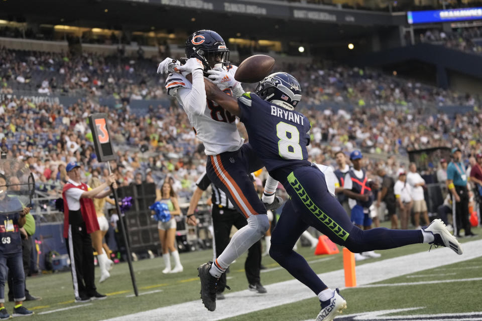 Seattle Seahawks cornerback Coby Bryant, right, breaks up a pass intended for Chicago Bears wide receiver Isaiah Coulter, left, during the second half of a preseason NFL football game, Thursday, Aug. 18, 2022, in Seattle. (AP Photo/Stephen Brashear)