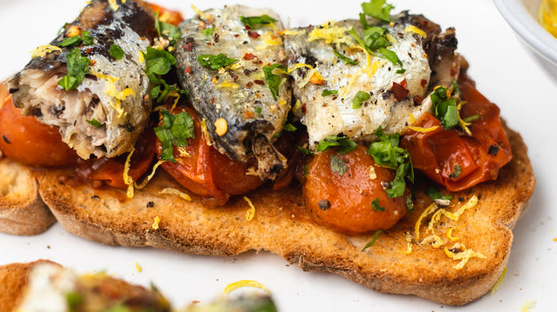 Close up of sardine and tomato toast