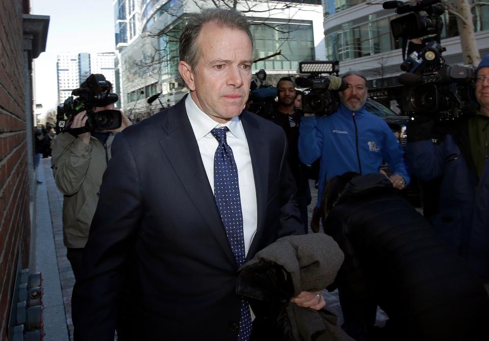 Gordon Ernst, former Georgetown tennis coach, departs federal court in Boston on Monday, March 25, 2019, after facing charges in a nationwide college admissions bribery scandal. (AP Photo/Steven Senne) ORG XMIT: BX115