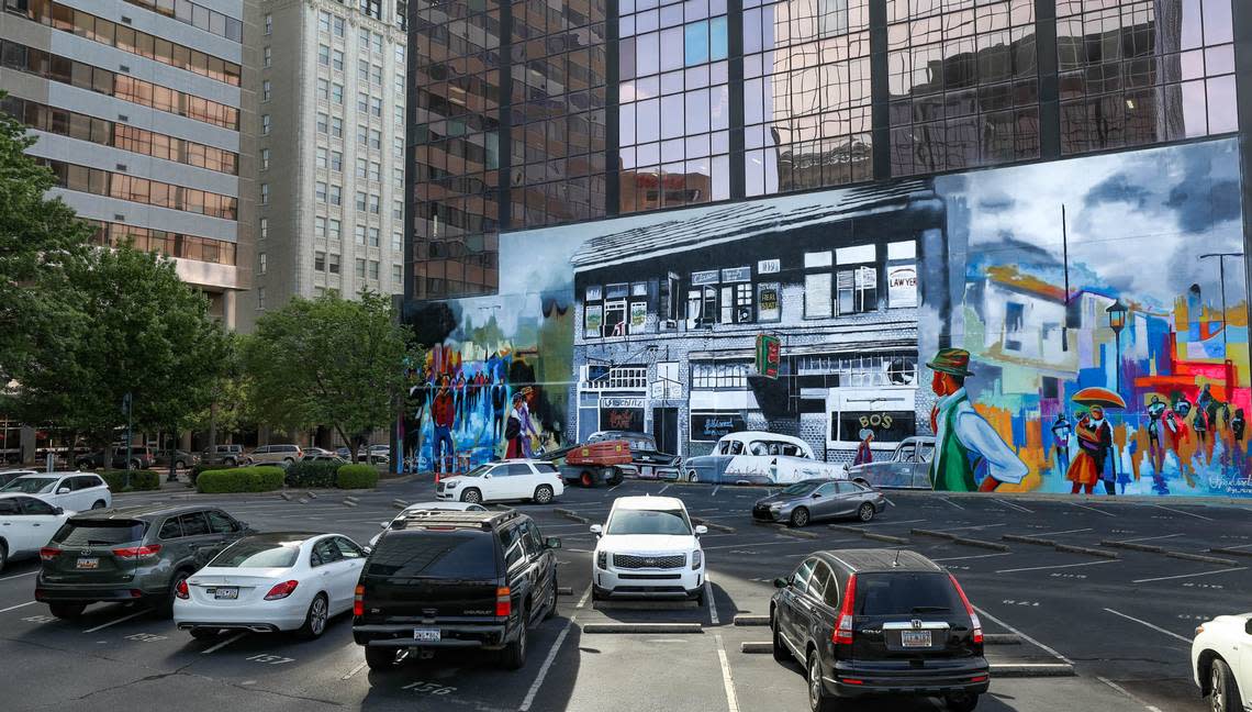 A mural, painted by artist Ija Charles, features a rendering of a 1950’s era Black business district that once stood on Columbia’s Washington Street.