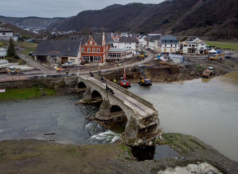 The remains of a bridge lead over the Ahr river in Resch in the Ahrtal valley, southern Germany, Tuesday, Dec.14, 2021. The floods in July claimed almost 200 lives, many of them in the narrow Ahr Valley that's best known for its vineyards and as a picturesque hiking destination. (Photo/Michael Probst)