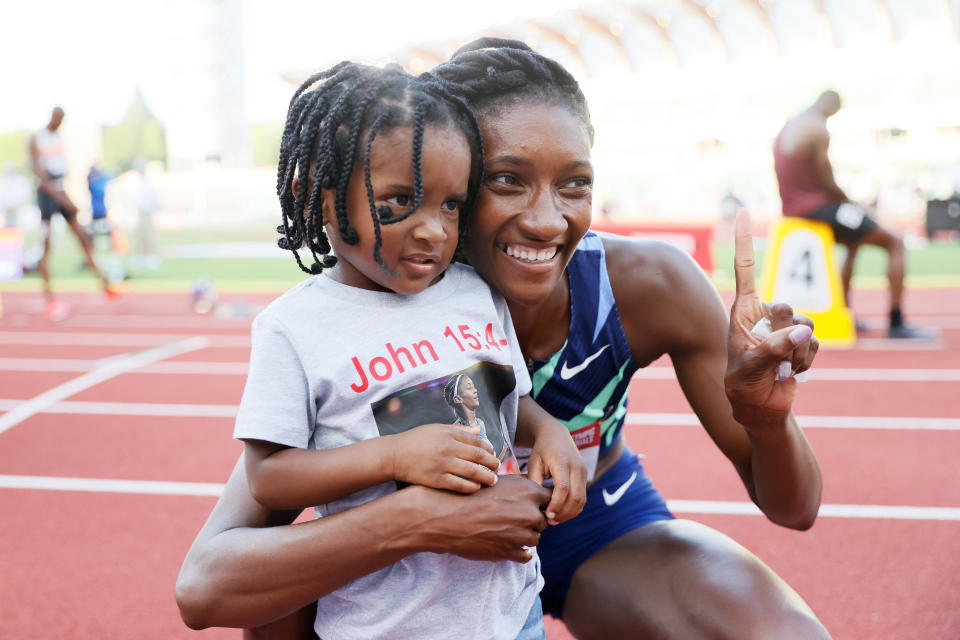 EUGENE, OREGON - JUNE 20: Quanera Hayes celebrates with her son Demetrius after finishing first in the Women's 400 Meters Final on day three of the 2020 U.S. Olympic Track & Field Team Trials at Hayward Field on June 20, 2021 in Eugene, Oregon. (Photo by Steph Chambers/Getty Images)