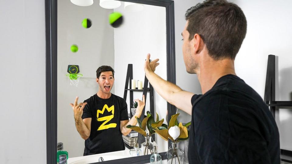 A trick shot using a mirror and twins.