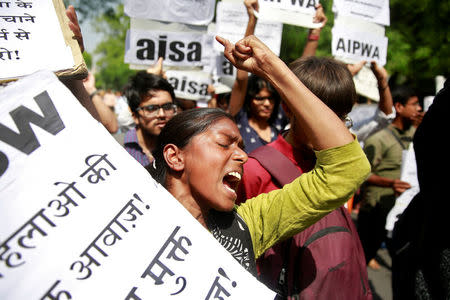 FILE PHOTO: A woman reacts at a protest against the rape of an eight-year-old girl, in Kathua, near Jammu and a teenager in Unnao, Uttar Pradesh state, in New Delhi, India April 12, 2018. REUTERS/Cathal McNaughton