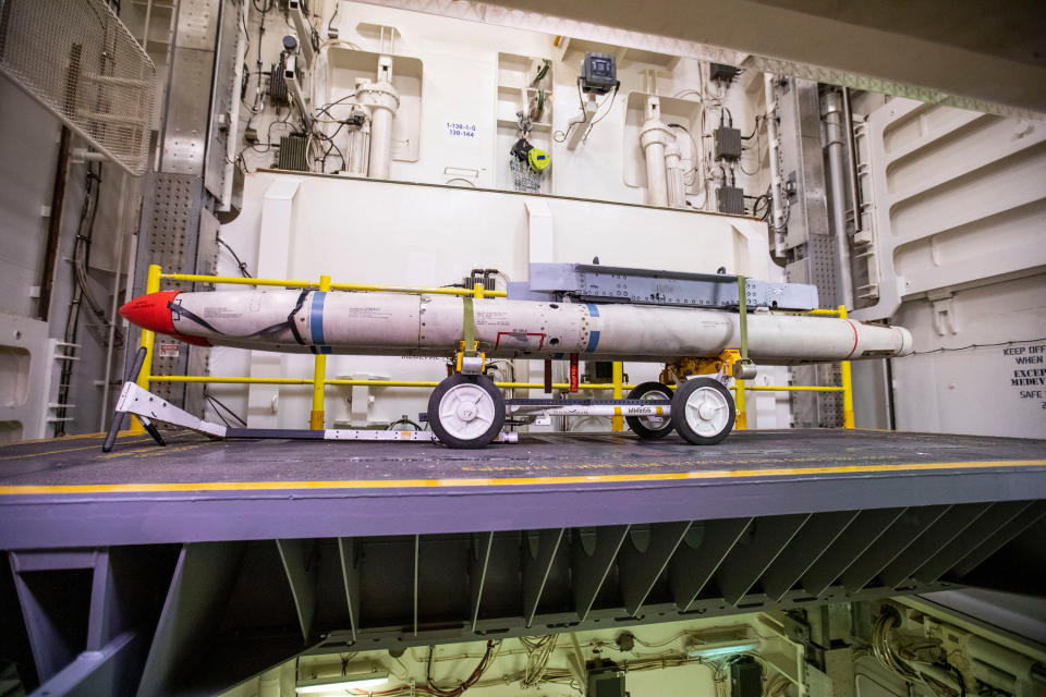 Missiles sit on the electromagnetic weapons elevator in the hangar bay aboard the USS Gerald R. Ford CVN-78 on Oct. 6, 2022. The elevator is one of the new pieces of technology on the ship that streamlines the weapons-moving process and cuts down on time. (Kendall Warner/The Virginian-Pilot/Tribune News Service via Getty Images)