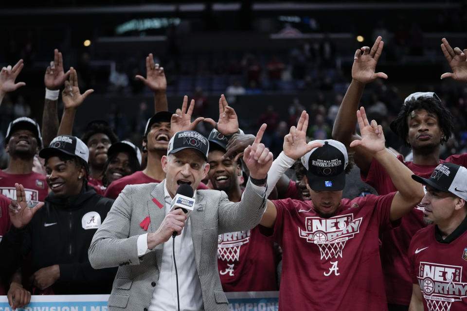 Alabama head coach Nate Oats celebrates with players after a win over Clemson in an Elite 8 college basketball game in the NCAA tournament Saturday, March 30, 2024, in Los Angeles. (AP Photo/Ashley Landis)