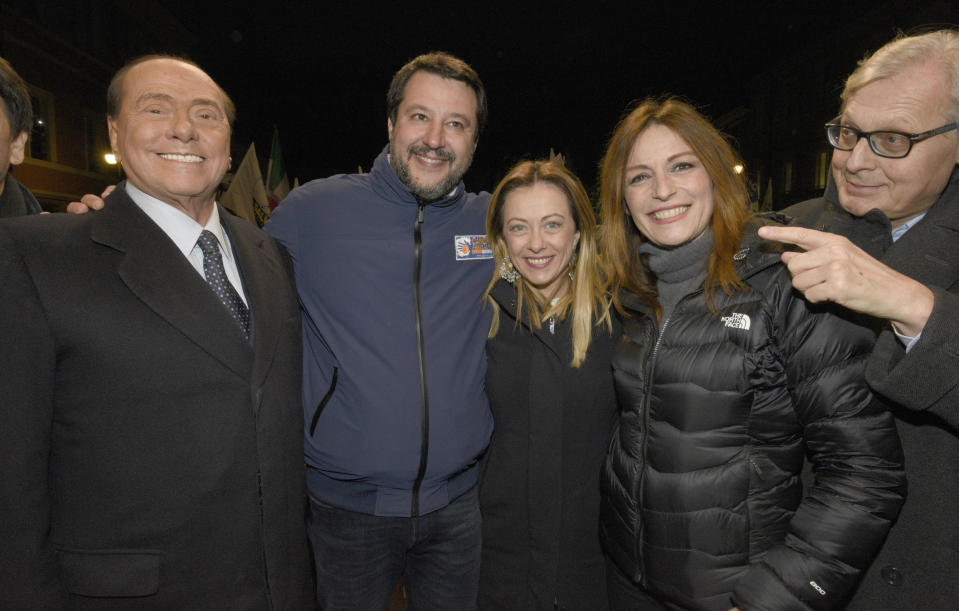 From left, Silvio Berlusconi, Matteo Salvini , Giorgia Meloni, Lucia Borgonzoni and Vittorio Sgarbi hold their final electoral rally in Ravenna, Italy, Friday, Jan. 24, 2020. Matteo Salvini is betting that the road to Rome runs through Emilia-Romagna. The right-wing populist leader is campaigning hard for his League to take control of the wealthy northern region that has been a left-wing stronghold since World War II. (Stefano Cavicchi/LaPresse via AP)