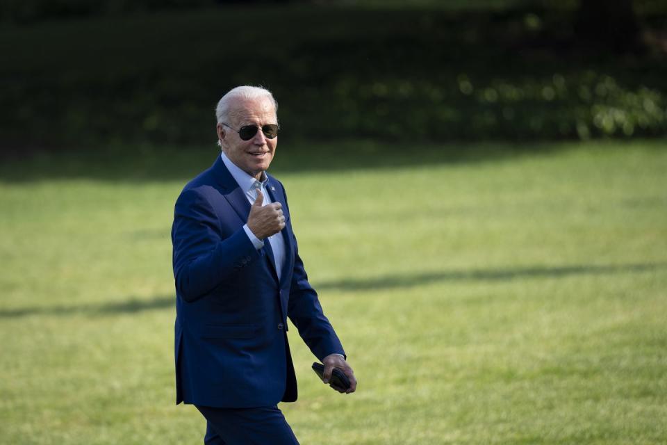 washington, dc july 20 us president joe biden gestures toward reporters as he departs marine one and walks to the oval office on the south lawn of the white house july 20, 2022 in washington, dc biden traveled to somerset, massachusetts to discuss his next steps on addressing climate change he delivered remarks at the site of the now closed brayton point power plant, which is being turned into the states first offshore wind manufacturing facility photo by drew angerergetty images