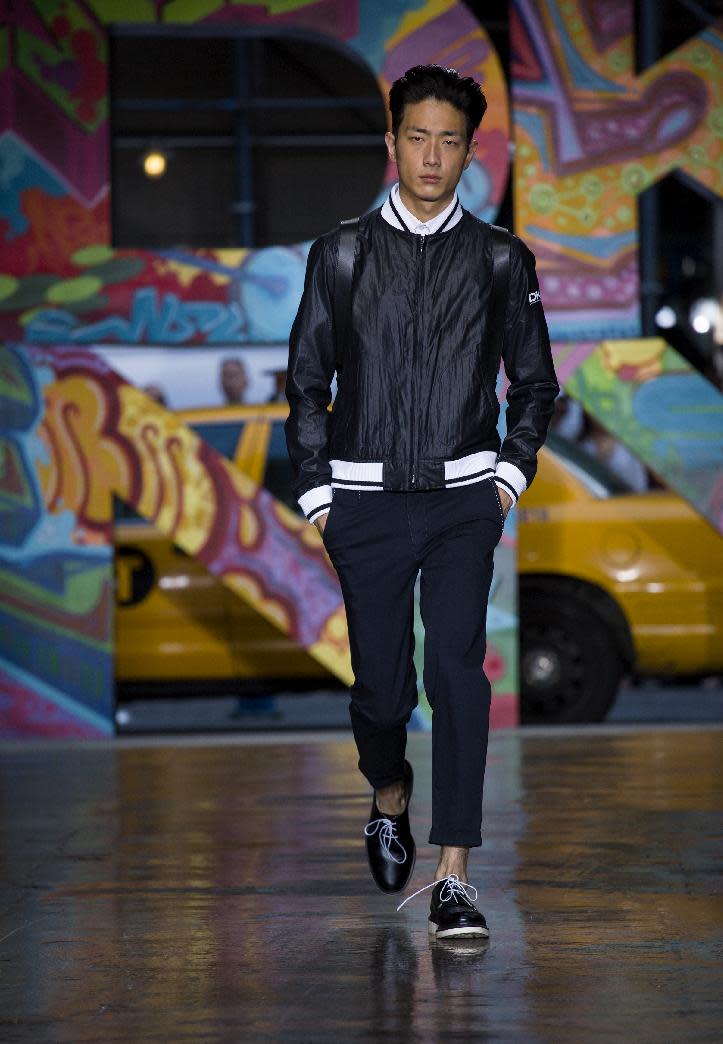 The DKNY Spring 2014 collection is modeled during Fashion Week in New York, Sunday, Sept. 8, 2013. (AP Photo/Craig Ruttle)