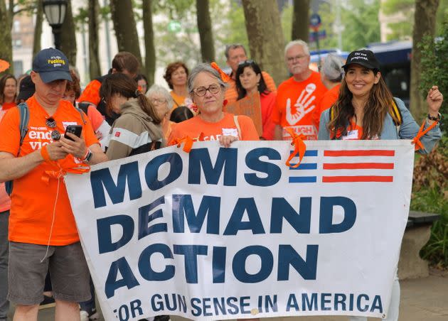 Marchers with gun safety advocacy group Moms Demand Action, which has been calling for stronger restrictions on guns for a decade.