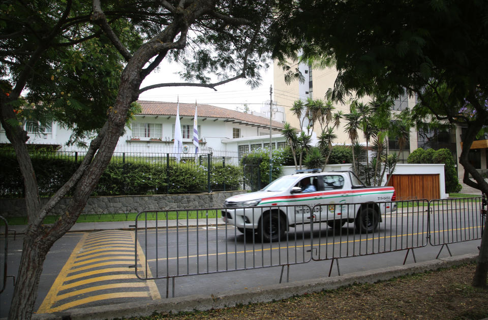 Barriers stand outside the residence of Uruguay's ambassador to Peru where Peru's former President Alan Garcia took refuge and asked for asylum, in Lima, Peru, Monday, Dec. 3, 2018. Garcia said Monday he would cooperate with prosecutors investigating him for corruption after Uruguay turned down his asylum request and forced him to leave the residence. (AP Photo/Mauricio Munoz)