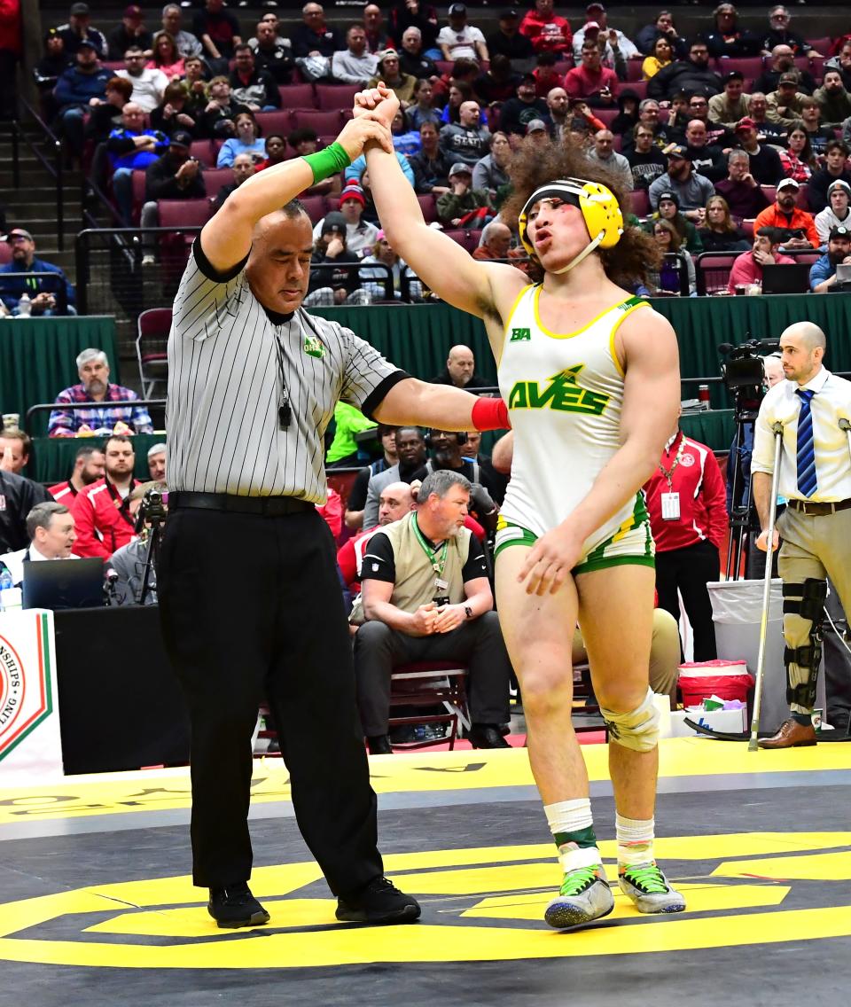 Eugene Harney of Sycamore raises his hand in victory as he takes home first place in Division I at 150 pounds at the OHSAA 86th annual boys wrestling state tournament March 10-12, 2023.