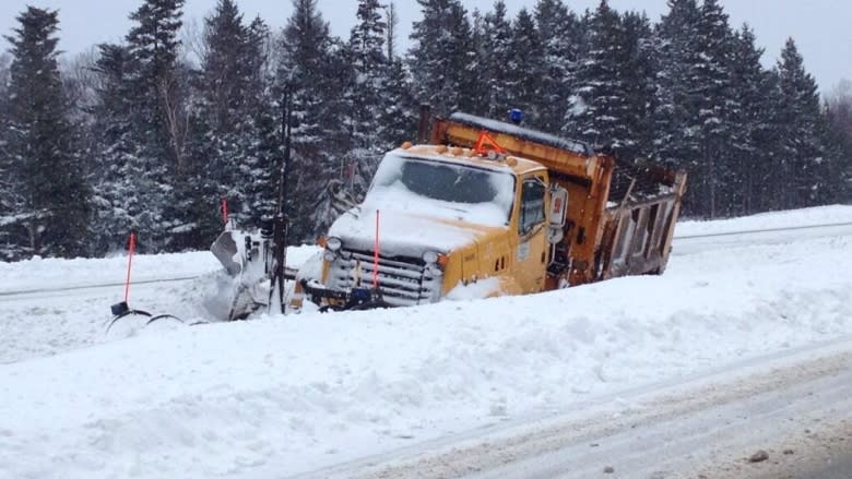 A snow plow on the side of the road on the Trans-Canada Highway near Little Rapids.