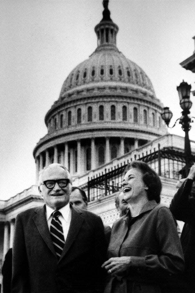 Sandra Day O'Connor laughs as she stands alongside Sen. Barry Goldwater, R-Ariz., just after her confirmation by the Senate to become an associate justice of the the Supreme Court, on Capitol Hill in Washington, D.C., on Sept. 21, 1981. O'Connor, the first woman appointed to the U.S. Supreme Court, died on Dec. 1.