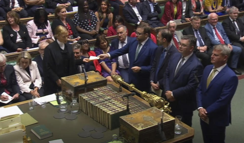 In this grab taken from video on Tuesday, Sept. 3, 2019 Members of Parliament announce the result of a vote for allowing a cross-party alliance to take control of the Commons agenda on Wednesday in a bid to block a no-deal Brexit on October 31 at the House of Commons, in London. (House of Commons/PA via AP)