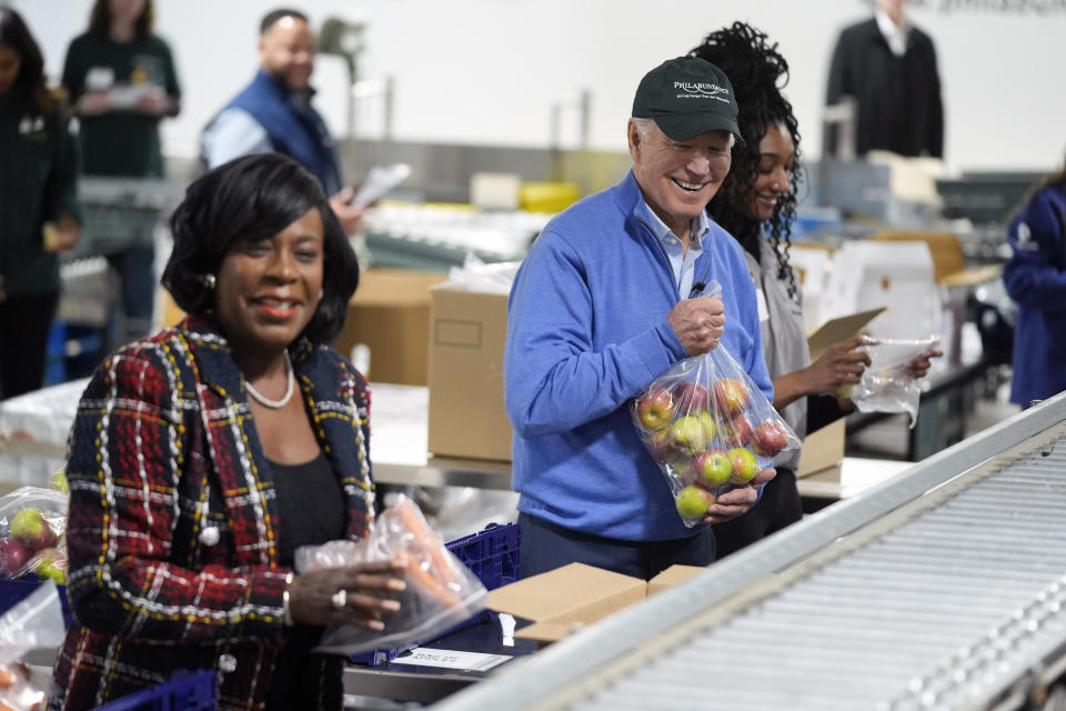 President Joe Biden volunteers at Philabundance, a hunger relief organization, to mark Martin Luther King, Jr., day, Monday, Jan. 15, 2024, in Philadelphia, with Philadelphia Mayor Cherelle Parker, left. (AP Photo/Evan Vucci)