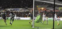 Swansea City's Wilfried Bony (2nd L) scores a goal against Stoke City during their English Premier League soccer match at the Liberty Stadium in Swansea, Wales, November 10, 2013.