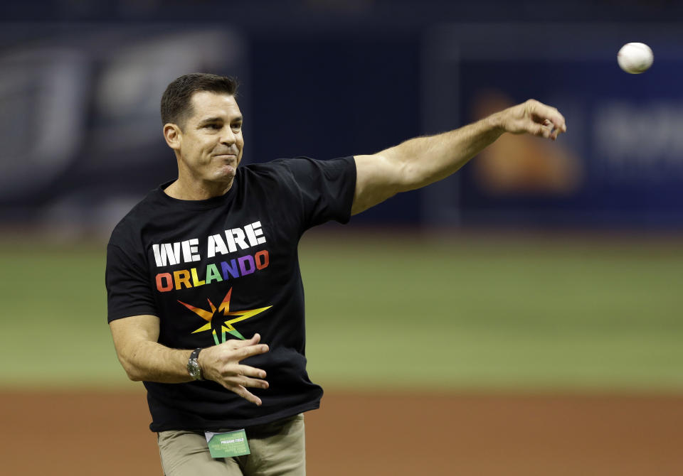 Bill Bean, MLB's vice president of Social Responsibility and Inclusion, throws out the ceremonial first pitch before a baseball game between the Tampa Bay Rays and the San Francisco Giants, Friday, June 17, 2016, in St. Petersburg, Fla. (AP Photo/Chris O'Meara)