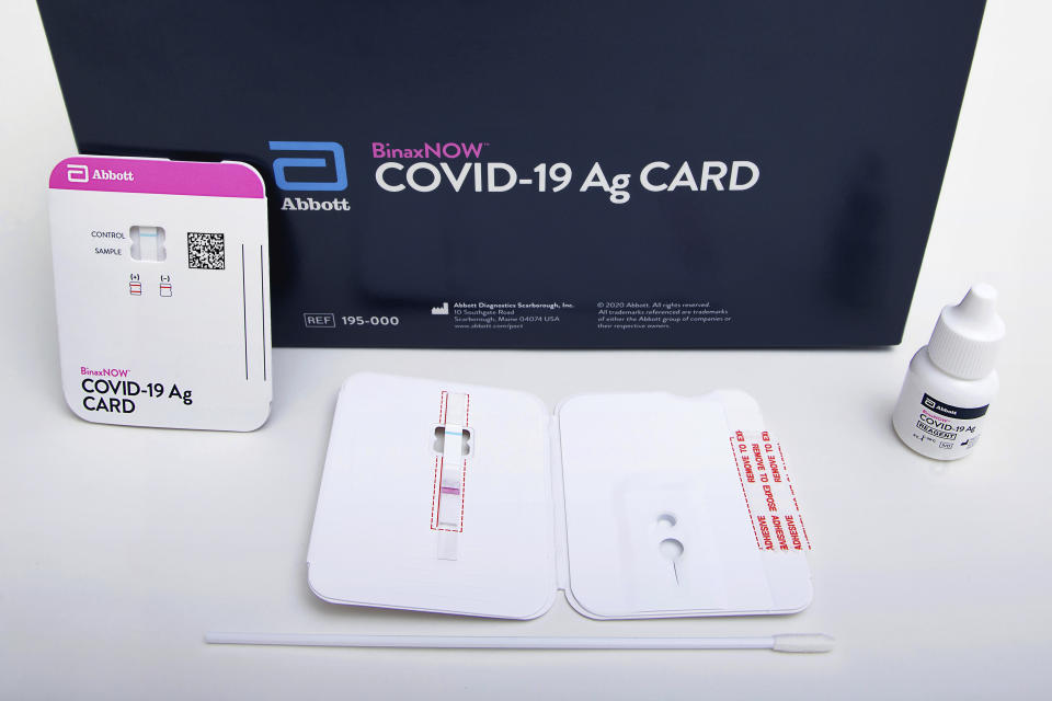 This image provided by Abbott Laboratories in August 2020 shows the company's BinaxNOW rapid COVID-19 nasal swab test. The Food and Drug Administration on Wednesday, Aug. 26, 2020, authorized BinaxNOW, the first rapid coronavirus test that doesn’t need any special computer equipment to get results. (Abbott Laboratories via AP)