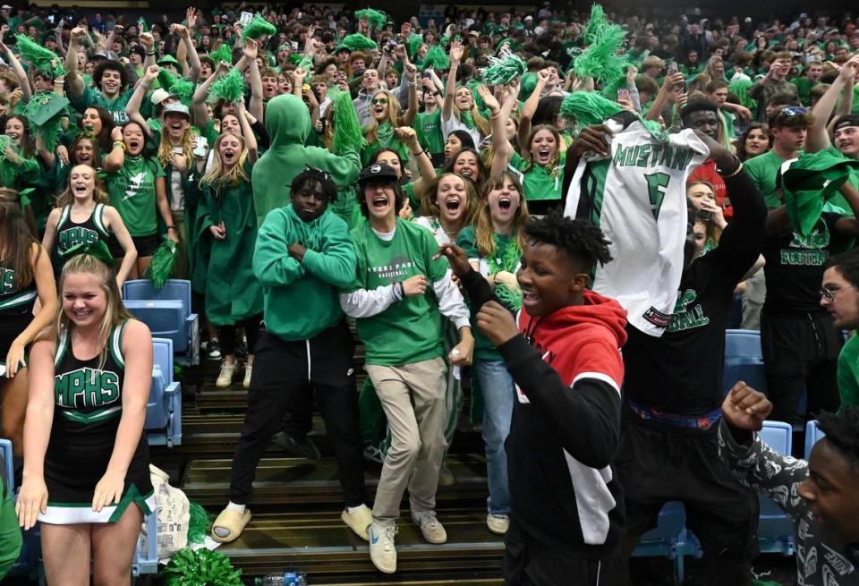 Myers Park students celebrate the boys basketball teams 74-60 victory over Richmond Senior in the NCHSAA state 4A championship game at the Dean Smith Center on Saturday, March 11, 2023.