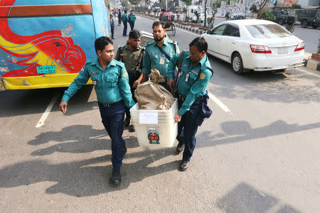 Law enforcement officials are seen carrying voting materials including ballot boxes ahead of 11th general election which will be held on December 30 in Dhaka, Bangladesh December 29, 2018. REUTERS/Stringer