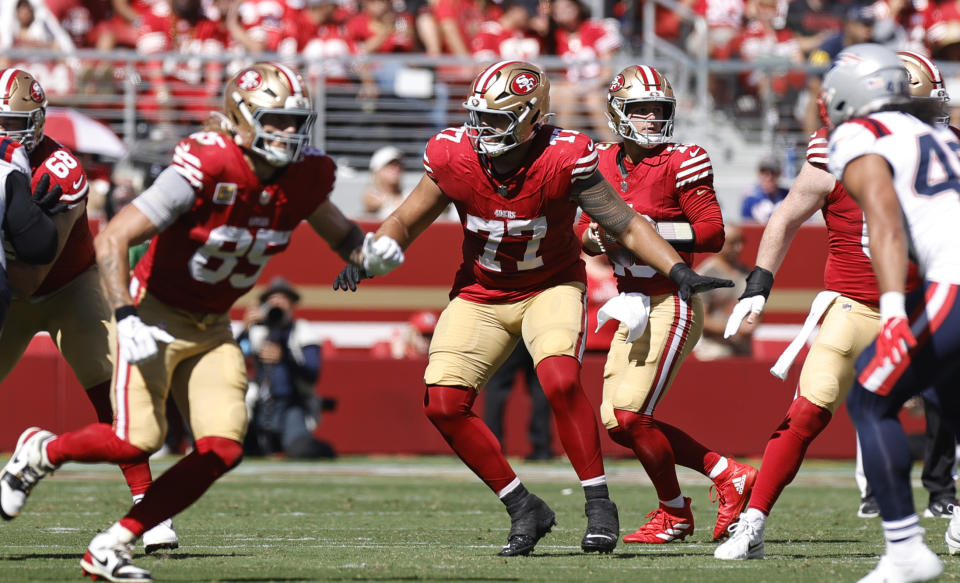 SANTA CLARA, CA - SEPTEMBER 29: Dominick Puni #77 of the San Francisco 49ers blocks during the game against the New England Patriots at Levi's Stadium on September 29, 2024 in Santa Clara, California. The 49ers defeated the Patriots 30-13. (Photo by Michael Zagaris/San Francisco 49ers/Getty Images)