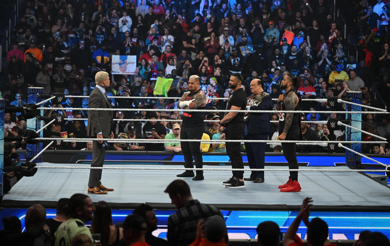 Cody Rhodes stares down Roman Reigns and the Bloodline (WWE)