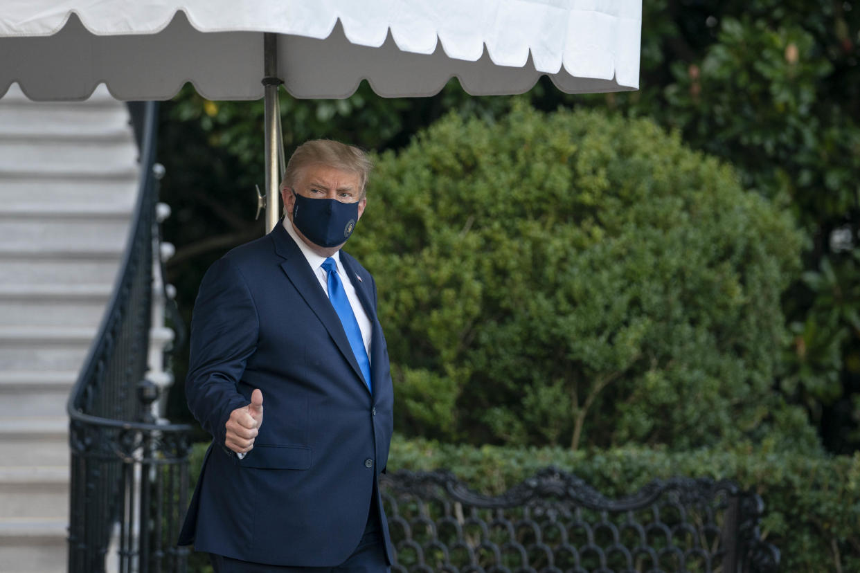 U.S. President Donald Trump walks along the South Lawn of the White House before boarding Marine One in Washington, D.C., U.S., on Friday, Oct. 2, 2020. Trump will be taken to Walter Reed National Military Medical Center to be treated for Covid-19, the White House said. Photographer: Sarah Silbiger/Pool/Sipa USA