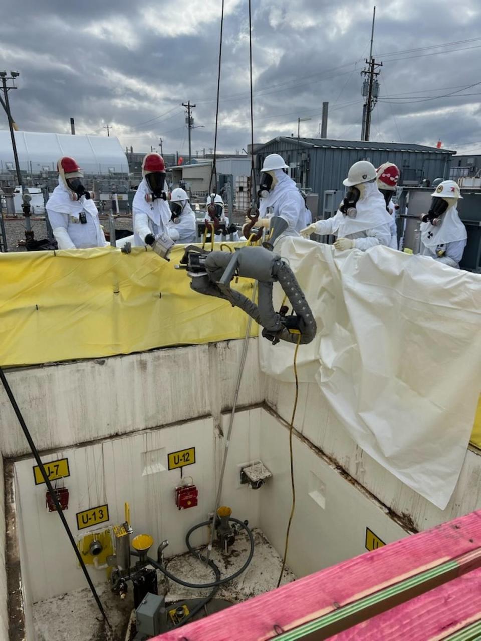 HPM Corp. holds the contract to provide occupational medical services at the Hanford site, including at the tank farms. Here Hanford workers remove highly contaminated equipment.