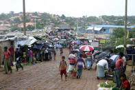 People shop for vegetables at the Kutupalong Rohingya refugee camp in Cox's Bazar, Bangladesh, Tuesday, June 2, 2020. Authorities in Bangladesh have confirmed the first death of a Rohingya refugee from the coronavirus, as infections rise in sprawling camps where more than 1 million Rohingya Muslims have been living since fleeing from neighboring Myanmar. The 71-year-old refugee died Saturday at Ukhiya in Cox's Bazar, and samples collected from him tested positive on Monday, said Abu Toha M.R. Bhuiyan, chief health coordinator of the office of the Refugee, Relief and Repatriation Commissioner. (AP Photo/Shafiqur Rahman)