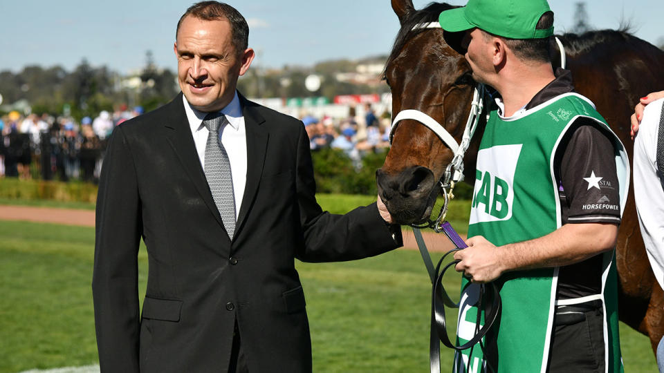 Chris Waller poses with Winx after winning the Turnbull Stakes. (Photo by Vince Caligiuri/Getty Images)