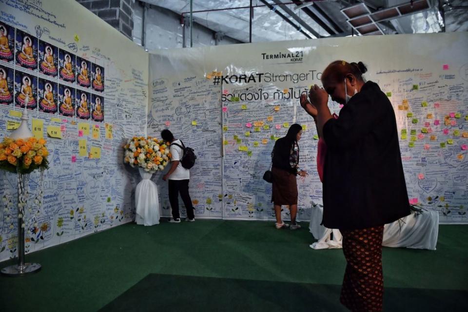People write condolence messages in the Terminal 21 shopping mall one week after a lone soldier shot and killed 29 people during a 17-hour-long shooting spree in several locations across the city, in the northeastern Thai province of Nakhon Ratchasima on February 15, 2020.<span class="copyright">Lillian Suwanrumpha—AFP via Getty Images</span>