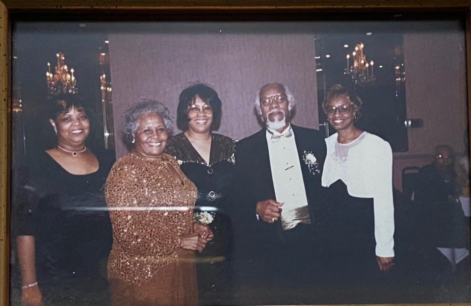 Thomas and Nellie Bostick were married in 1947 and soon after moved to Rochester, where they had three daughters. Here, the family celebrates Thomas and Nellie's 50th wedding anniversary in 1997.