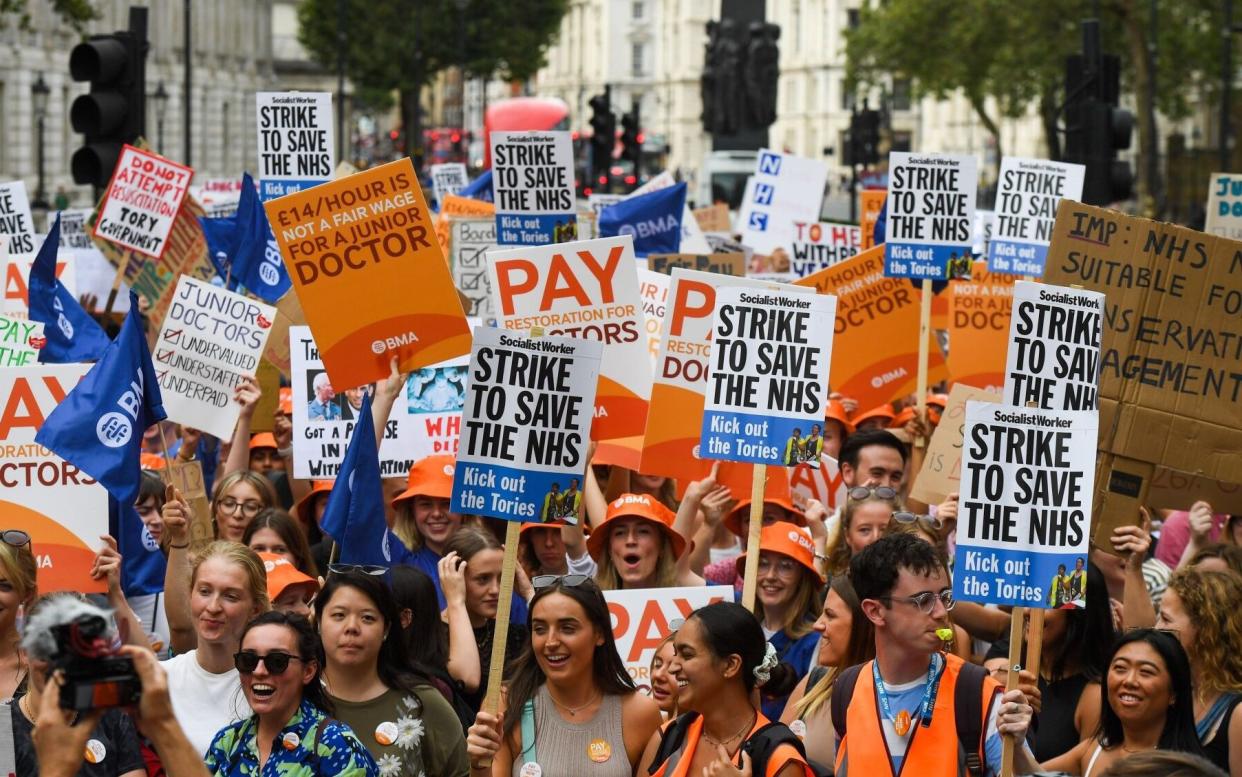 Junior doctors protest with placards outside Downing Street