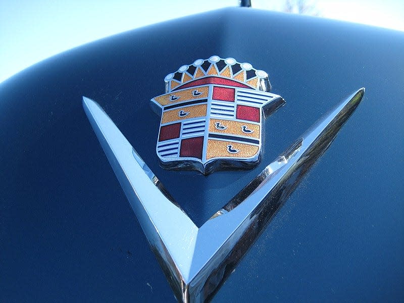 The famous Cadillac coat of arms dates back to 1905 and became a registered trademark in 1906. It is the symbol of Detroit founder Antoine de la Mothe Cadillac and his wife, Marie Therese Coin-Coin, divided into two parts. The crown (Couronne) symbolizes France's six ancient courts.