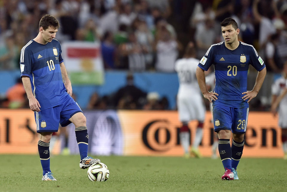 FILE - Argentina's Lionel Messi, left, and Sergio Aguero react after Germany's Mario Goetze scored the opening goal during the World Cup final soccer match between Germany and Argentina at the Maracana Stadium in Rio de Janeiro, Brazil, Sunday, July 13, 2014. (AP Photo/Martin Meissner, File)