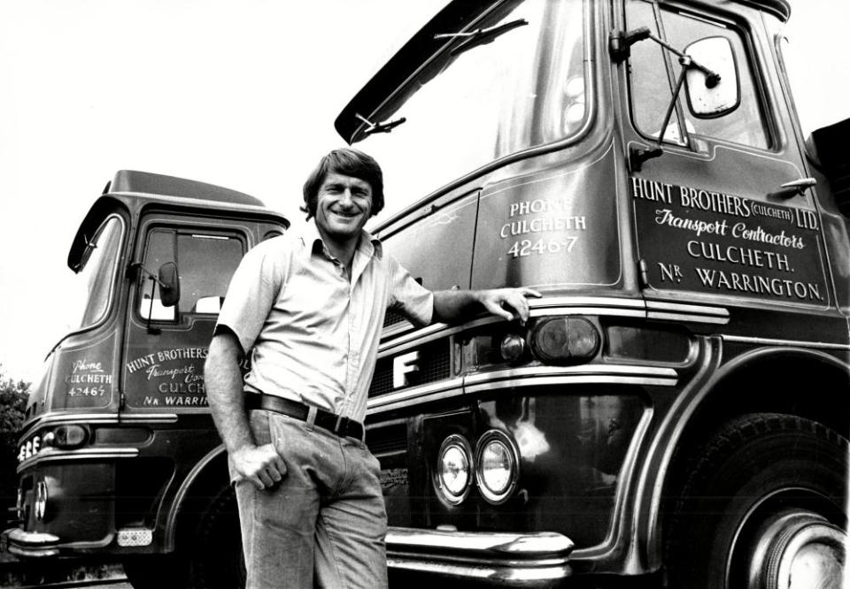 Roger Hunt poses with a few of the trucks in the yard at his family’s haulage business in Culcheth, Warrington.