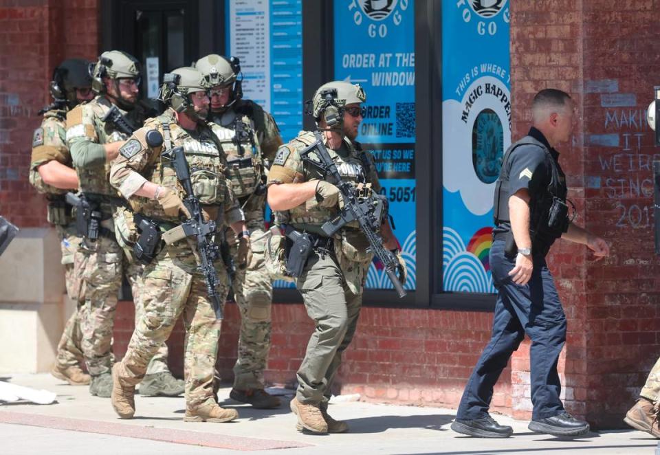 SWAT members and Wichita police are on scene of an incident Wednesday afternoon on Douglas. Police have blocked off Douglas between St. Francis and Mosley. Police in this photo were entering a building at St. Francis and Douglas.