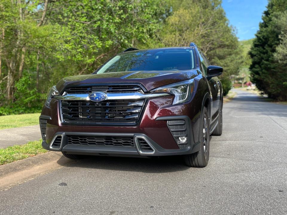 Subaru Ascent front end with large back grille, large chrome bar, and LED headlights that turn with the steering wheel.