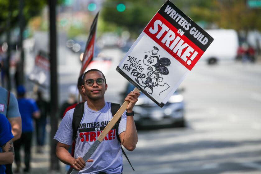 BURBANK, CA - MAY 10: A T.V. writer Courtney Perdue, 34, joins Writers Guild of America strikers rally in front of Disney, Burbank, CA. (Irfan Khan / Los Angeles Times)