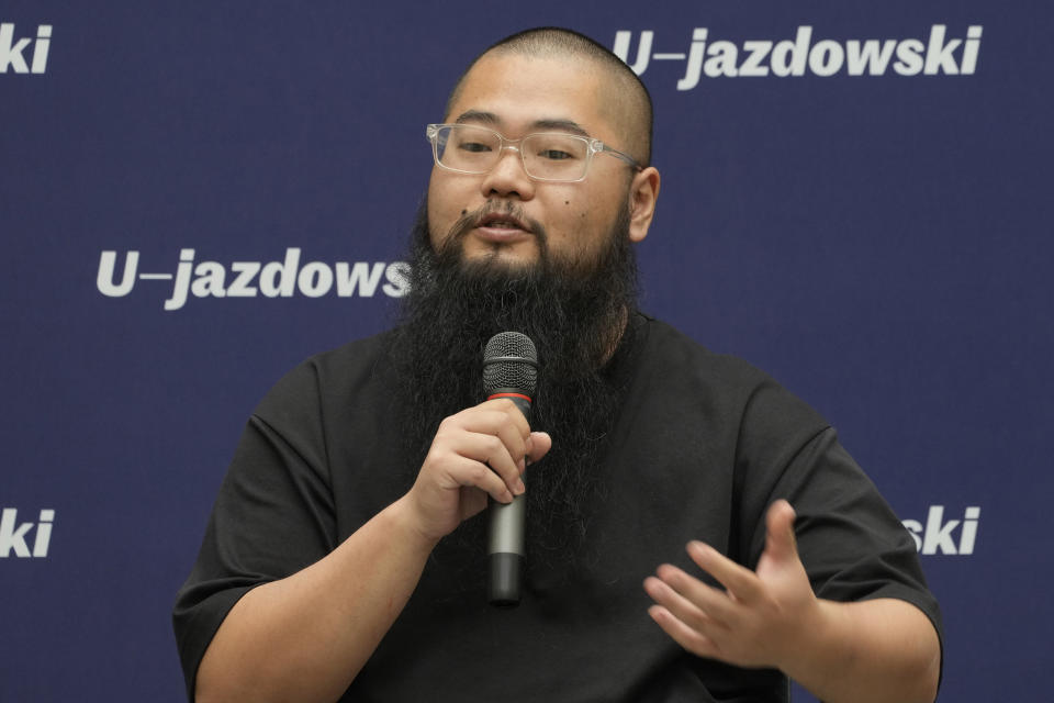 Chinese dissident artist Badiucao speaks at a news conference ahead of the opening of a new exhibition in Warsaw, Poland on Friday, June 16, 2023. The museum faced demands from the Chinese embassy not to open the exhibition, which is highly critical of China's human rights record. (AP Photo/Czarek Sokolowski)