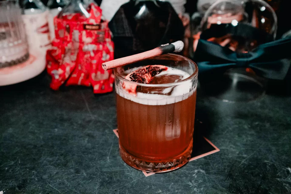 Taylor Adams - cocktail drink with cinnamon stick