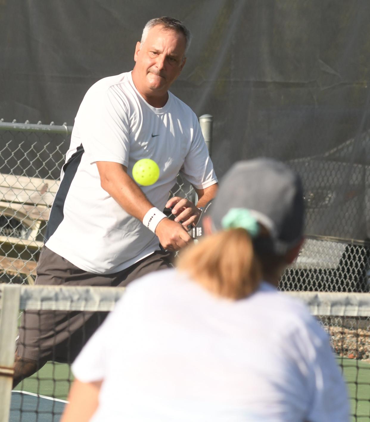 Tom Polk plays pickleball at Middleton Park in Oak Island. The sport is gaining popularity throughout the Wilmington area.