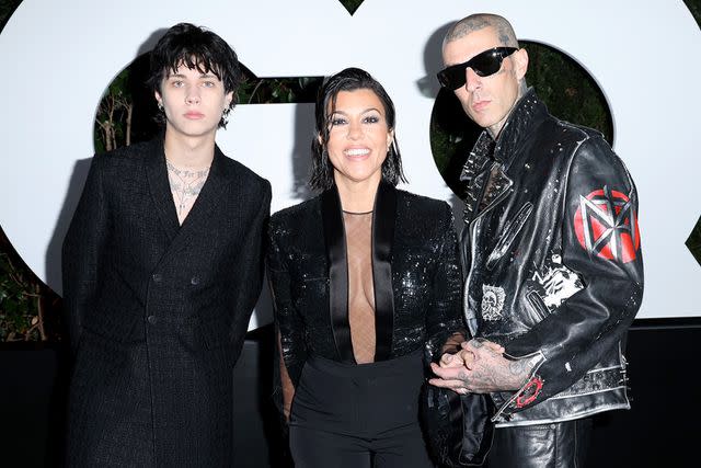 <p>Phillip Faraone/Getty Images</p> Landon Barker, Kourtney Kardashian Barker and Travis Barker attend the GQ Men of the Year Party 2022 at The West Hollywood EDITION on November 17, 2022 in West Hollywood, California.