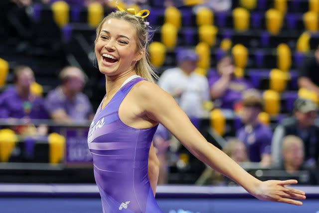 <p>Jonathan Mailhes/CSM/Shutterstock </p> Olivia Dunne competes at the Pete Maravich Assembly Center in Baton Rouge, LA