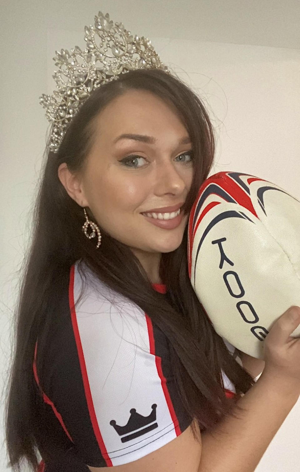 Rugby-playing beauty queen poses in rugby outfit with tiara