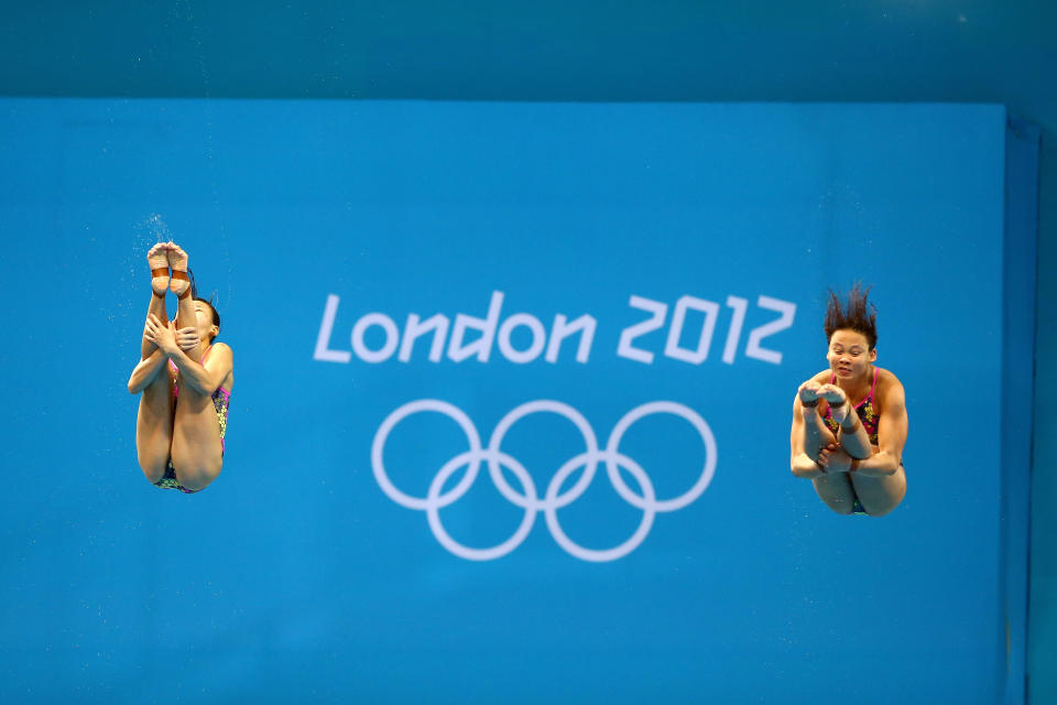 LONDON, ENGLAND - JULY 29: Pandelela Rinong Pamg and Jun Hoong Cheong of Malaysia compete in the Women's Synchronised 3m Springboard final on Day 2 of the London 2012 Olympic Games at the Aquatics Centre at Aquatics Centre on July 29, 2012 in London, England. (Photo by Al Bello/Getty Images)