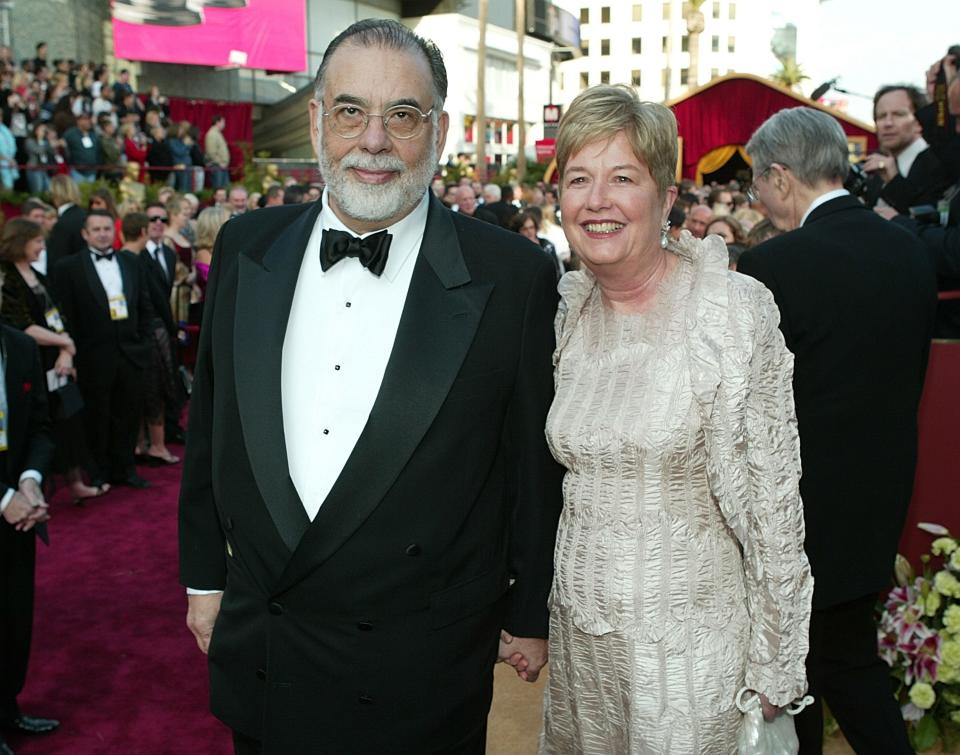 Francis Ford Coppola and Eleanor Coppola holding hands on the red carpet