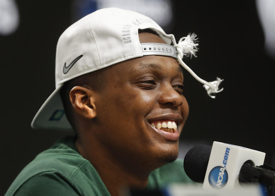 Michigan State guard Cassius Winston (5) smiles while answering questions during a news conference after beating Duke 68-67 of a NCAA men's East Regional final college basketball game in Washington, Sunday, March 31, 2019. (AP Photo/ Mark Tenally)